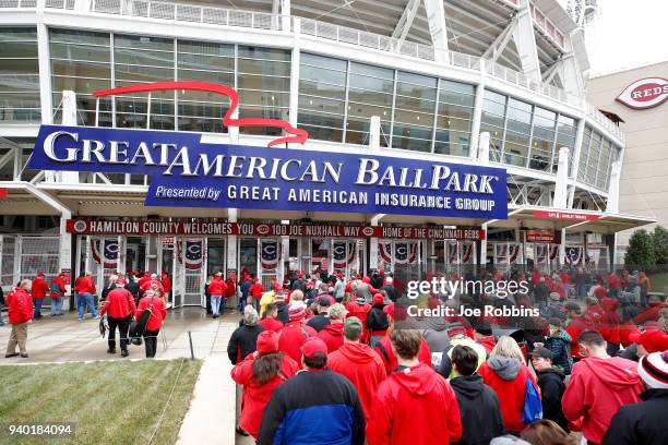 Fans enter the ball park prior to the Opening Day game between the Cincinnati Reds and Washington Nationals at Great American Ball Park on March 30,...