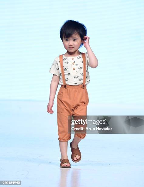 Model walks the runway wearing Haven Kids at 2018 Vancouver Fashion Week - Day 7 on March 25, 2018 in Vancouver, Canada.