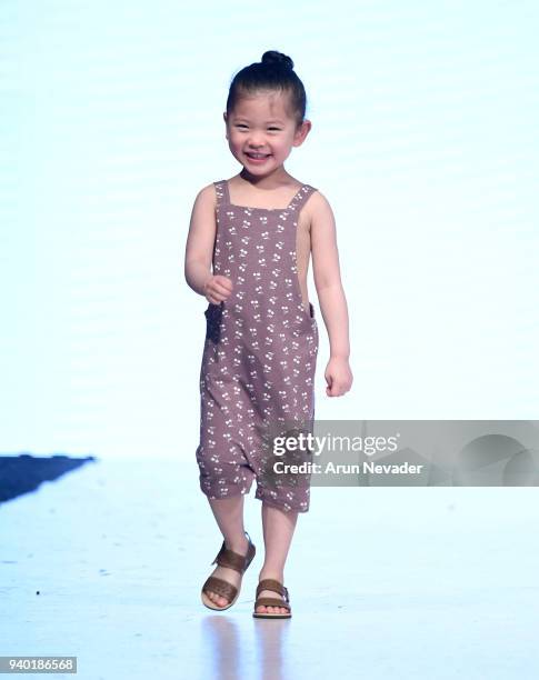 Model walks the runway wearing Haven Kids at 2018 Vancouver Fashion Week - Day 7 on March 25, 2018 in Vancouver, Canada.