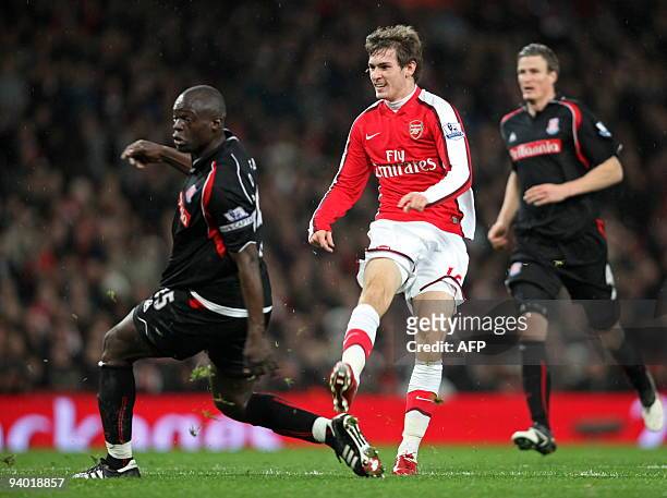 Arsenal's Welsh midfielder Aaron Ramsey scores the second goal past Stoke City's Senegalese player Abdoulaye Faye during the English Premier League...