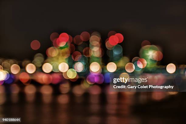 lights bokeh effect on river thames - gary colet stock pictures, royalty-free photos & images