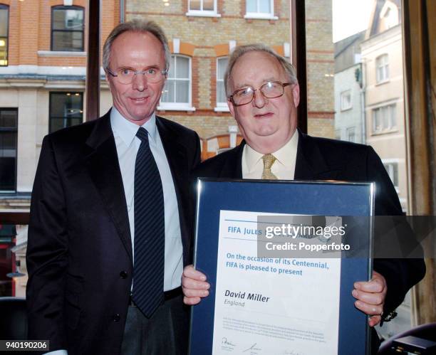 David Miller, the Daily Telegraph sports writer , receives the Jules Rimet Award from England manager Sven Goran Eriksson for covering 12 World Cups...