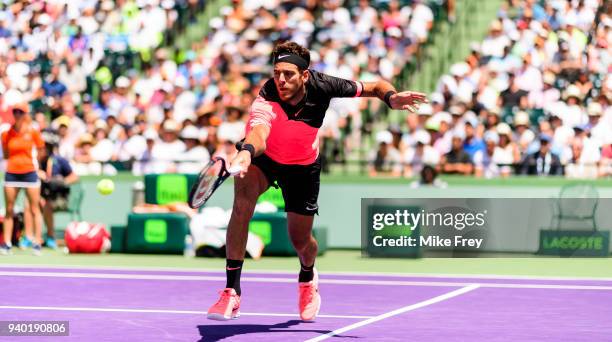 Juan Martin Del Potro of Argentina hits a backhand to John Isner of the USA during the semifinals match on Day 12 of the Miami Open Presented by Itau...