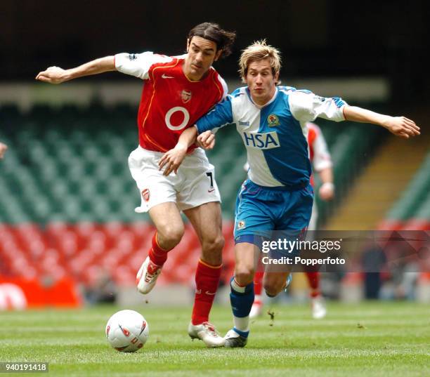 Robert Pires of Arsenal and Morten Gamst Pedersen of Blackburn Rovers in action during the FA Cup Semi-Final match between Arsenal and Blackburn...