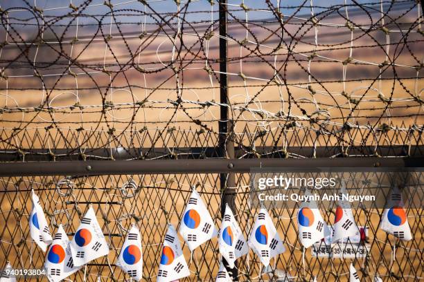 korea flags hang on fence at dmz area of south and north korea - gap closers stock pictures, royalty-free photos & images