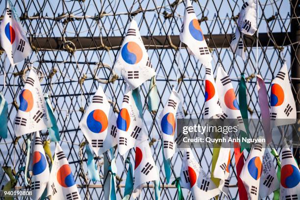 korea flags hang on fence at dmz area of south and north korea - gap closers stock pictures, royalty-free photos & images