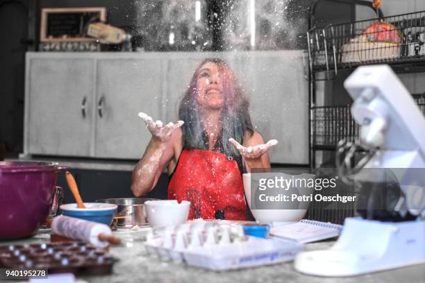 a young woman baking in the kitchen at home. - cooking mess imagens e fotografias de stock