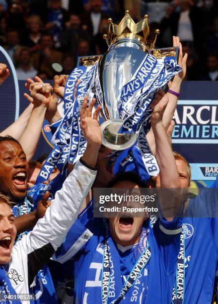 John Terry of Chelsea holds the trophy aloft following their FA Barclays Premiership title victory over Charlton Athletic at Stamford Bridge in...