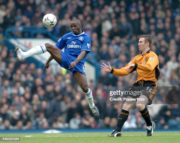 Claude Makalele of Chelsea clears from Kenny Miller of Wolverhampton Wanderers during the Barclaycard Premiership match between Chelsea and...