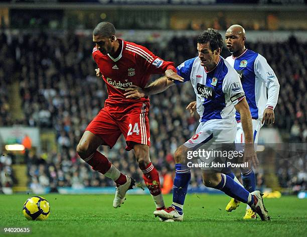 Glen Johnson of Liverpool surrounded by Ryan Nelsen of Blackburn Rovers during the Barclays Premier League match between Blackburn Rovers and...