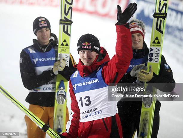 Adam Malysz of Poland celebrates the third place in the Ski Jumping HS 138 event during day one of the FIS World Cup on December 5, 2009 in...