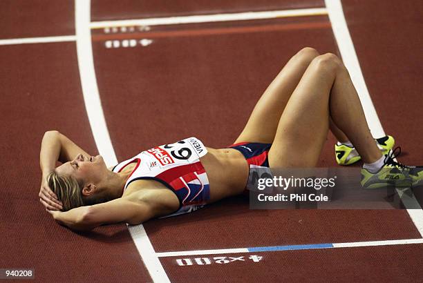 Catherine Murphy of Great Britain lies exhausted on the track after the 400 metres final during the Spar European Indoor Athletics Championships held...