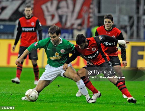 Uemit Korkmaz of Frankfurt battles for the ball with Andreas Ivanschitz of Mainz during the Bundesliga match between Eintracht Frankfurt and FSV...
