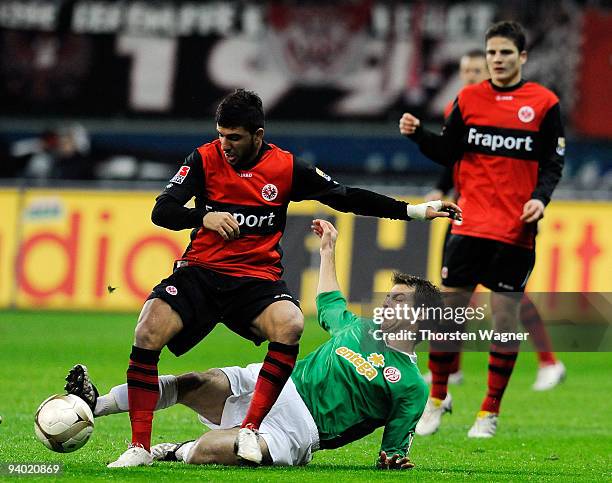 Uemit Korkmaz of Frankfurt battles for the ball with Andreas Ivanschitz of Mainz during the Bundesliga match between Eintracht Frankfurt and FSV...