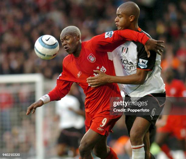 Djibril Cisse of Liverpool holds off Zat Knight of Fulham during the Barclays Premiership match between Fulham and Liverpool at Craven Cottage in...