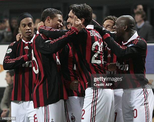 Milan's forward Marco Borriello celebrates with teammates Ronaldinho of Brazil, Thiago Silva and Clarence Seedorf of Netherlands after he scored...