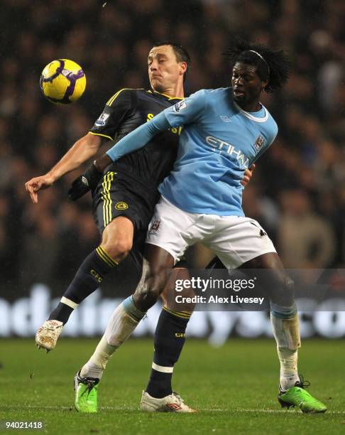 John Terry of Chelsea tangles with Emmanuel Adebayor of Manchester City during the Barclays Premier League match between Manchester City and Chelsea...