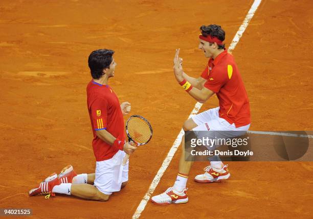 Feliciano Lopez and Fernando Verdasco of Spain celebrate after beating Radek Stepanek and Tomas Berdych of Czech Republic during Davis Cup World...