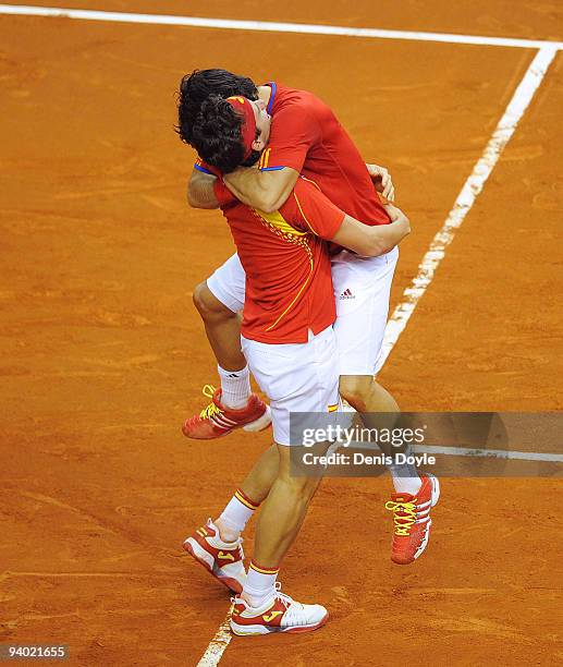 Feliciano Lopez and Fernando Verdasco of Spain celebrate after beating Radek Stepanek and Tomas Berdych of Czech Republic during Davis Cup World...