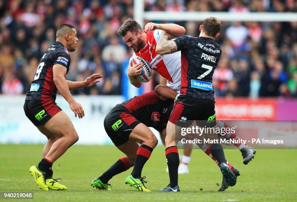 St Helens' Luke Douglas takes on Wigan Warriors' Sam Powell during the Super League match at the Totally Wicked Stadium, St Helens.