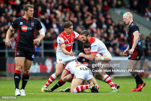 St Helens' Kyle Amor tackles Wigan's Oliver Gildart during the Super League match at the Totally Wicked Stadium, St Helens.