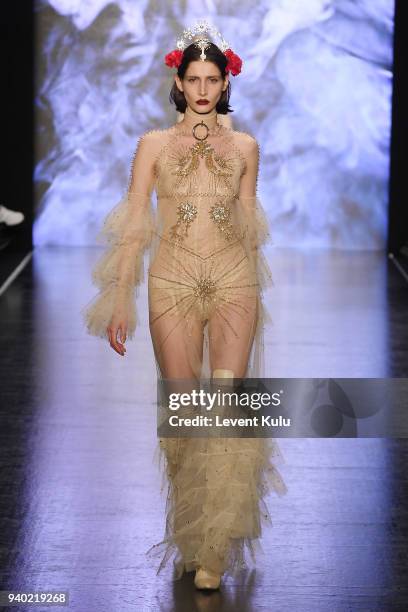 Model walks the runway at the Zeynep Tosun show during Mercedes Benz Fashion Week Istanbul at Zorlu Performance Hall on March 30, 2018 in Istanbul,...