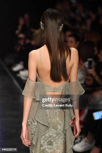 Model walks the runway at the Zeynep Tosun show during Mercedes Benz Fashion Week Istanbul at Zorlu Performance Hall on March 30, 2018 in Istanbul,...