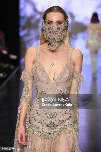 Model walks the runway at the Zeynep Tosun show during Mercedes Benz Fashion Week Istanbul at Zorlu Performance Hall on March 30, 2018 in Istanbul,...