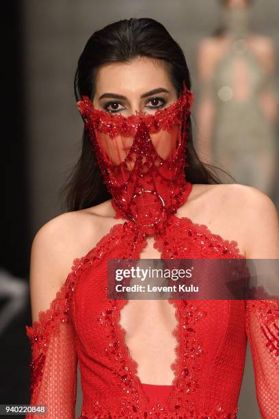 Model walks the runway at the Zeynep Tosun show during Mercedes Benz Fashion Week Istanbul at Zorlu Performance Hall on March 30, 2018 in Istanbul,...