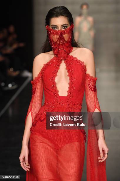 Model walks the runway at the Zeynep Tosun show during Mercedes Benz Fashion Week Istanbul at Zorlu Performance Hall on March 30, 2018 in Istanbul,...