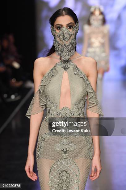 Model walks the runway at the Zeynep Tosun show during Mercedes Benz Fashion Week Istanbul at Zorlu Performance Hall on March 30, 2018 in Istanbul,...