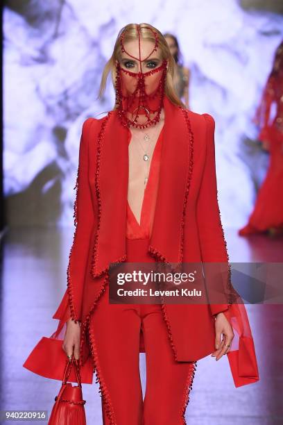 Model walks the runway at the Zeynep Tosun show during Mercedes Benz Fashion Week Istanbul at Zorlu Performance Hall on March 30, 2018 in Istanbul,...