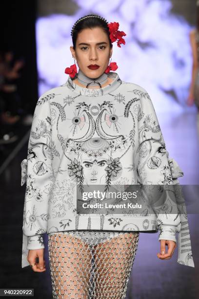 Model walks the runway at the Zeynep Tosun show during Mercedes Benz Fashion Week Istanbul at Zorlu Performance Hall on March 30, 2018 in Istanbul,...