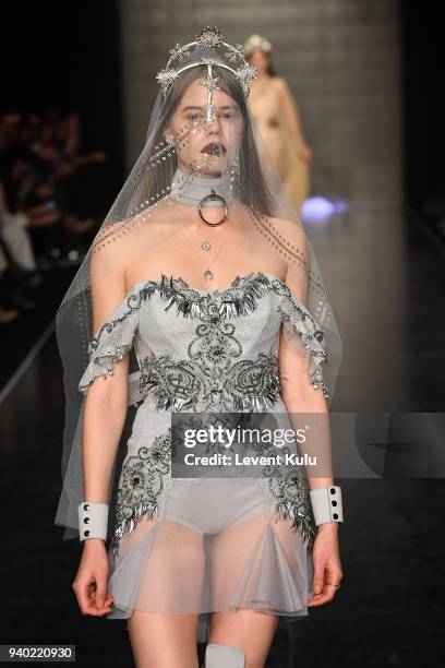 Model walks the runway at the Zeynep Tosun show during Mercedes Benz Fashion Week Istanbul at Zorlu Performance Hall on March 30, 2018 in Istanbul,...