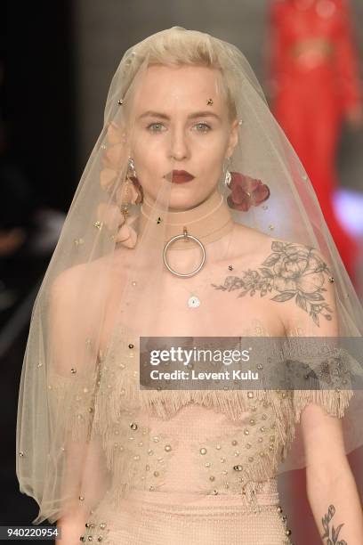 Model walks the runway at the Zeynep Tosun show during Mercedes Benz Fashion Week Istanbul at Zorlu Performance Hall on March 30, 2018 in Istanbul,...