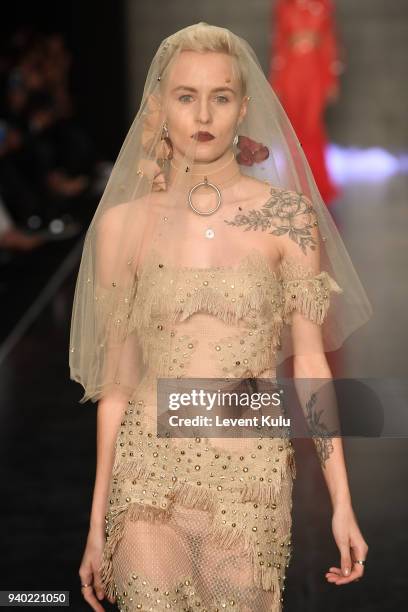 Model walks the runway at the Zeynep Tosun show during Mercedes Benz Fashion Week Istanbul at Zorlu Performance Hall on March 30, 2018 in Istanbul,...