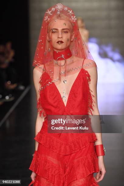 Model walks the runway at the Zeynep Tosun show during Mercedes Benz Fashion Week Istanbul at Zorlu Performance Hall on March 30, 2018 in Istanbul,...