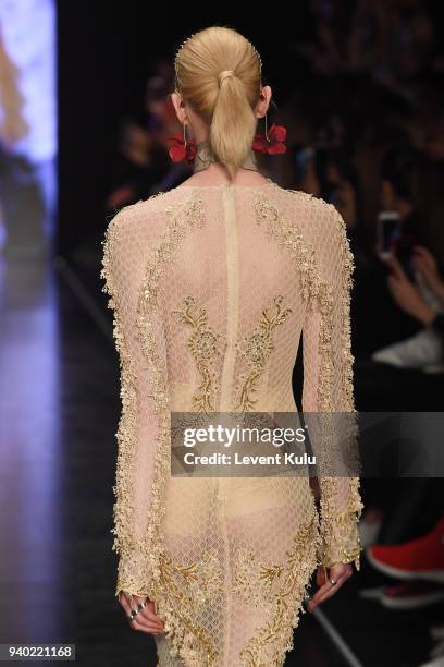 Model walks the runway at the Zeynep Tosun show during Mercedes Benz Fashion Week Istanbul at Zorlu Performance Hall on March 30, 2018 in Istanbul,...