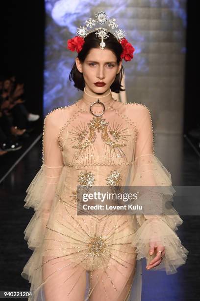 Model walks the runway at the Zeynep Tosun show during Mercedes Benz Fashion Week Istanbul at Zorlu Performance Hall on March 30, 2018 in Istanbul,...