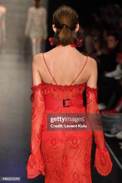 Model walks the runway at the Zeynep Tosun show during Mercedes Benz Fashion Week Istanbul at Zorlu Performance Hall on March 30, 2018 in Istanbul,...