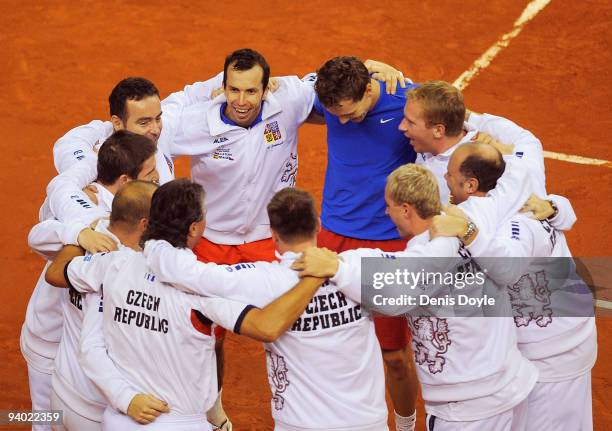 Radek Stepanek of Czech Republic embraces his team mates after losinig his doubles match against Feliciano Lopez and Fernando Verdasco of Spain in...