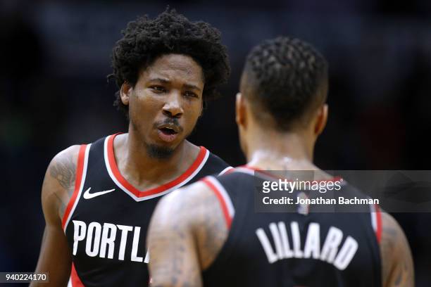 Ed Davis of the Portland Trail Blazers talks to Damian Lillard of the Portland Trail Blazers during the second half at the Smoothie King Center on...