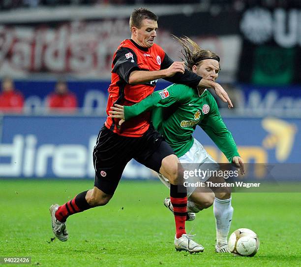 Alexander Meier of Frankfurt battles for the ball with Eugen Polanski of Mainz during the Bundesliga match between Eintracht Frankfurt and FSV Mainz...