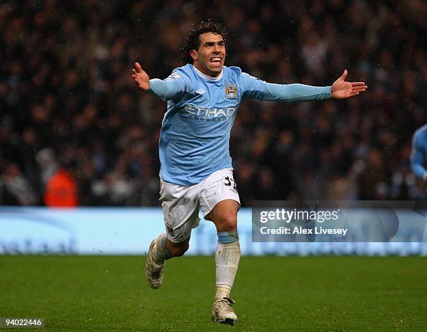 Carlos Tevez of Manchester City celebrates scoring his team's second goal during the Barclays Premier League match between Manchester City and...