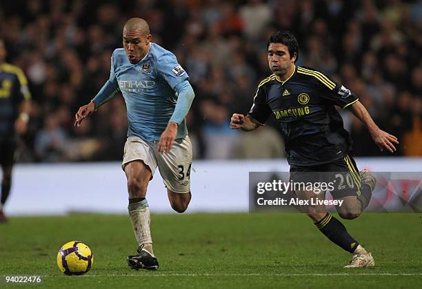 Nigel de Jong of Manchester City surges away from Deco of Chelsea during the Barclays Premier League match between Manchester City and Chelsea at the...