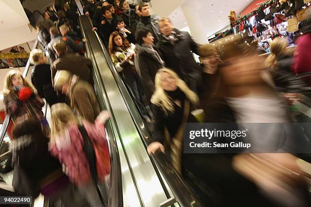 Shoppers ride escalators at the Alexa shopping mall on December 5, 2009 in Berlin, Germany. Retailers are hoping for a strong Christmas season to...