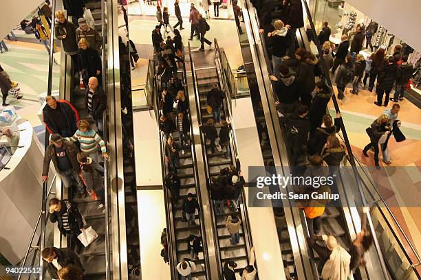 Shoppers ride escalators at the Alexa shopping mall on December 5, 2009 in Berlin, Germany. Retailers are hoping for a strong Christmas season to...