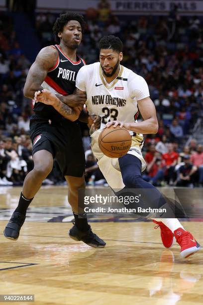 Anthony Davis of the New Orleans Pelicans drives against Ed Davis of the Portland Trail Blazers during the second half at the Smoothie King Center on...