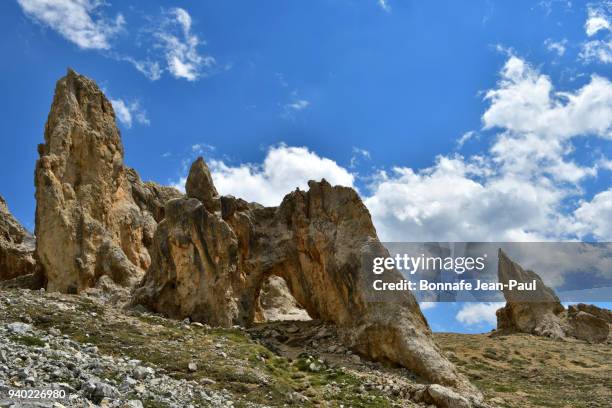 natural arch in this lunar landscape - briancon stock pictures, royalty-free photos & images