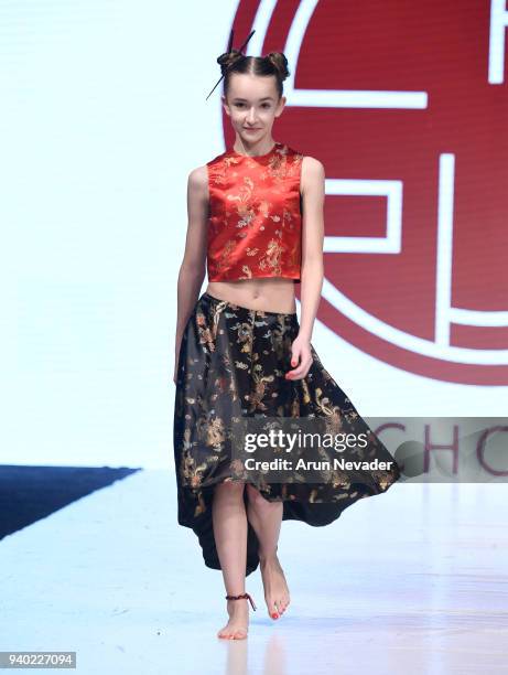 Model walks the runway wearing Kenneth Chow at 2018 Vancouver Fashion Week - Day 7 on March 25, 2018 in Vancouver, Canada.